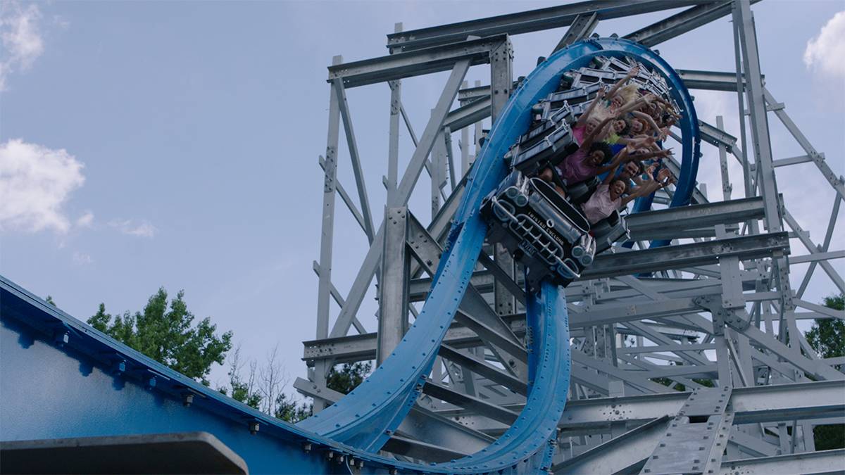 guests riding the Twisted Cyclone roller coaster at Six Flags over Georgia in Atlanta, Georgia, USA